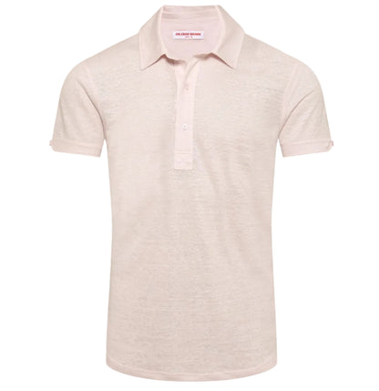 The Orlebar Brown Sebastian Linen Polo is a light pink, short-sleeve shirt crafted from breathable linen jersey with a tailored fit, classic collar, and three-button placket, shown against a plain white background.