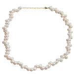 Introducing the Jia Jia Ocean Wild Pearl Necklace: A stunning piece handmade in NYC, featuring uniquely shaped freshwater pearls and a clasp with intricate 14 karat gold detailing. Brought to you by the renowned brand Jia Jia.