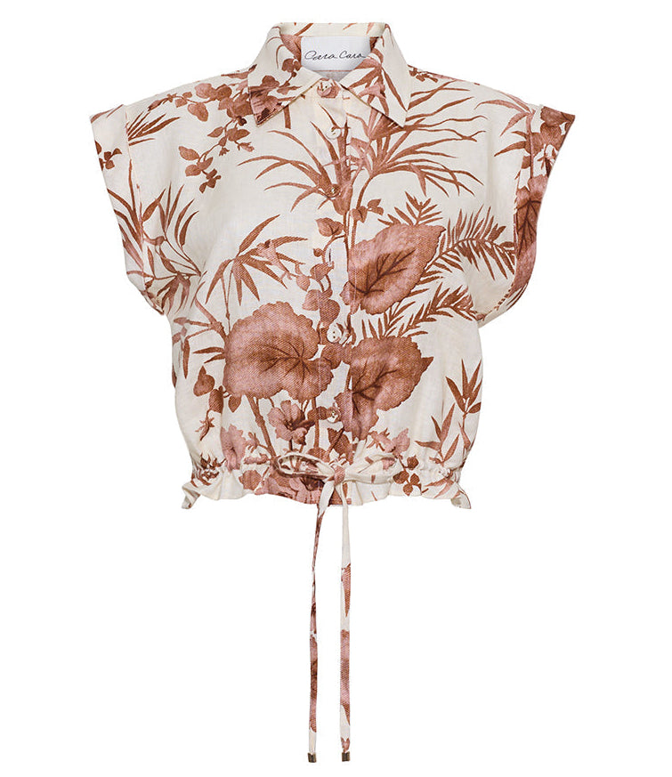The Octavia Top by Cara Cara is a sleeveless collared top with a brown botanical print, button-up front, dropped shoulders, and a stylish front waist tie.