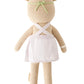 Olivia the Honey Bear by Cuddle + Kind (Regular 20") wears a white apron and green headband, shown from the back as if ready to tend a blooming garden.