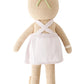 Olivia the Honey Bear by Cuddle + Kind is a 13" knitted teddy shown from the back, dressed in a white apron with crossed straps and a green headband—ready to tend her blooming garden.