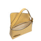 Yellow Wandler Oscar Baguette calf leather shoulder bag on white background.