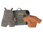 A small metal suitcase featuring travel stickers, a plaid overall, and a striped shirt are displayed together as part of the Maileg Overalls & Shirt in Suitcase set for Big Brother Mouse.