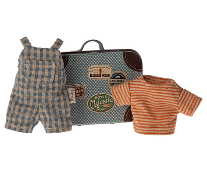 A small metal suitcase featuring travel stickers, a plaid overall, and a striped shirt are displayed together as part of the Maileg Overalls & Shirt in Suitcase set for Big Brother Mouse.