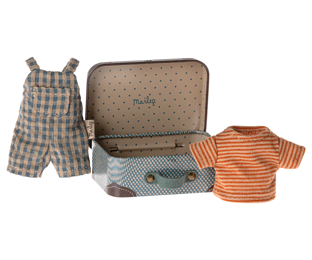 The Maileg Overalls & Shirt in Suitcase for Big Brother Mouse by Maileg features a small metal suitcase adorned with polka dots and a handle, containing a stylish clothes set: blue and white checkered overalls paired with an orange striped shirt.