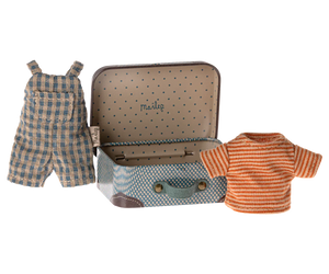 The Maileg Overalls & Shirt in Suitcase for Big Brother Mouse by Maileg features a small metal suitcase adorned with polka dots and a handle, containing a stylish clothes set: blue and white checkered overalls paired with an orange striped shirt.