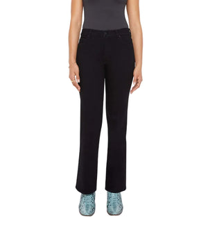 A person in a dark sleeveless top, Mother’s Lil Kick It black petite denim straight-leg pants, and light blue shoes stands with arms at their sides.