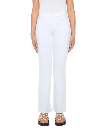 A person wearing Mother’s Petites Lil Kick It white high-rise straight leg jeans, a sleeveless white top, flat sandals, and minimal jewelry stands against a plain background.
