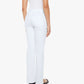 A person is standing with their back to the camera against a plain white background, wearing Mother’s Petites Lil Kick It high-rise straight leg jeans, a white sleeveless top, and black sandals.
