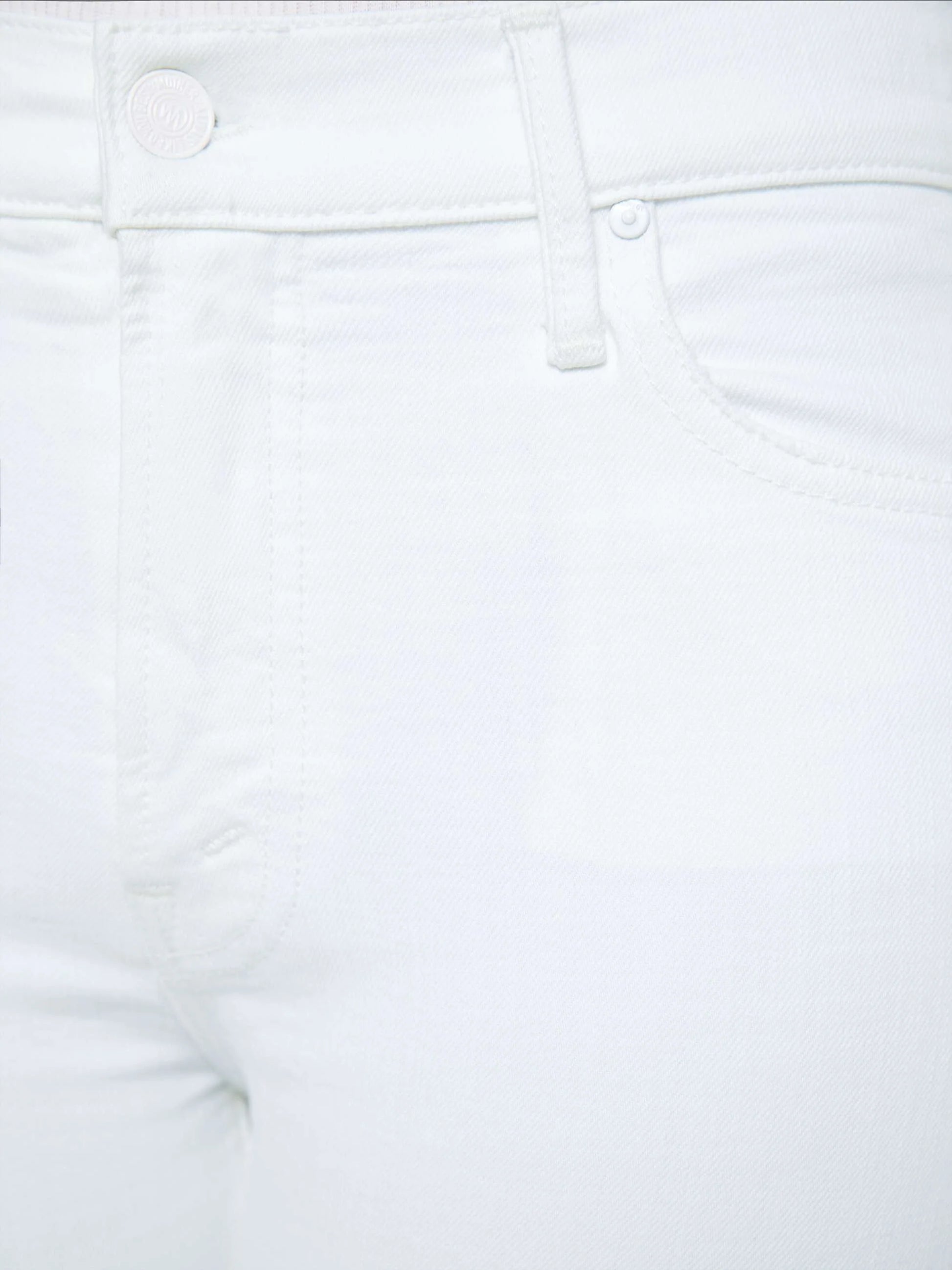 Close-up view of the front waist and hip area of the Petites Lil Kick It high-rise straight leg white denim jeans by Mother, highlighting the button, belt loop, pocket, and visible seams.