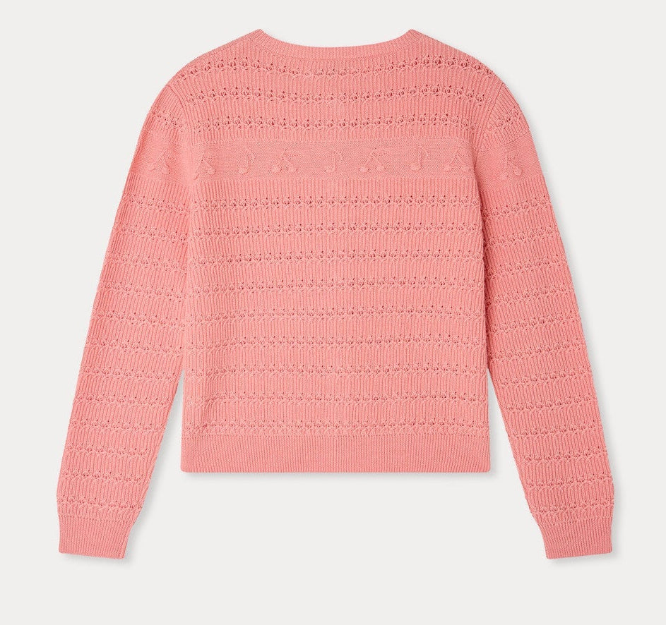 The Bonpoint Girls’ Mia Cardigan is a pink patterned knit sweater with a textured design, long sleeves, and raised cherry details, shown laid flat with the back facing up.