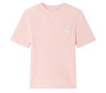 The Girls’ Melie Sweater by Bonpoint is a light pink, short-sleeve waffle knit shirt featuring a waﬄed texture and a white cherry patch on the left chest, shown against a plain white background. Ideal for those wanting the cozy comfort of an organic cotton sweater in a playful girls’ style.