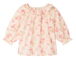Introducing the Baby Girls’ Dolci Blouse by Bonpoint—this long-sleeved cream blouse features a cheerful pink and yellow tropical floral print, a ruffled neckline, and elasticized cuffs. Made from soft organic cotton, this charming blouse is specially designed for children and perfect for any occasion.
