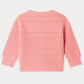 Bonpoint Baby Girls’ Mahana Cardigan in pink, featuring a decorative knit pattern and long sleeves, is displayed flat from the back. This design showcases subtle details across the upper section.