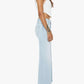 A woman stands in profile against a white background wearing the Mother Petites Lil Hustler Roller Fray high rise jeans, paired with a white sleeveless crop top and black heeled sandals.
