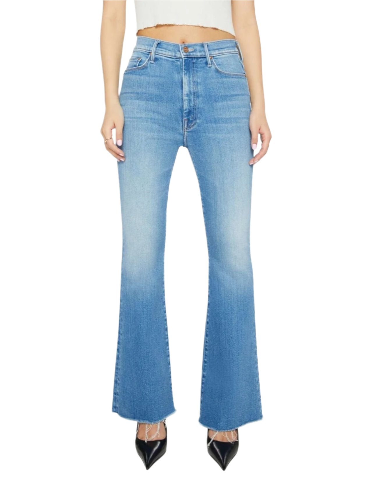 A person wearing Petites Lil High Waisted Weekender Fray jeans in light blue from Mother pairs them elegantly with black pointed shoes, completing the chic look with a white cropped top.