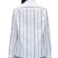 A person is seen from the back wearing a 3.1 Phillip Lim Poplin Shirt with Wave Embroidery, featuring black vertical stripes on a white background and an embroidered wavy stripe. The shirt has long sleeves and offers a relaxed fit, making it an ideal match with light blue jeans.