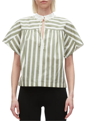 A person wearing the 3.1 Phillip Lim Striped Open Neck Top with Ties, paired with black pants.