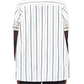 Photographed from behind, a person wears the Adam Lippes Trapeze Stripe Shirt—a short-sleeved, button-up design with ivory and black stripes in Italian cotton.