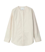 The 3.1 Phillip Lim Collarless Cotton Poplin Shirt features long sleeves and an off-white, band collar design, evoking a modernist painter’s smock, displayed laid flat on a white background.