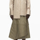 Wearing the 3.1 Phillip Lim Asymmetrical Stripe Trapeze Shirt, a person pairs it with an olive green striped midi skirt and taupe heels, standing against a plain background.