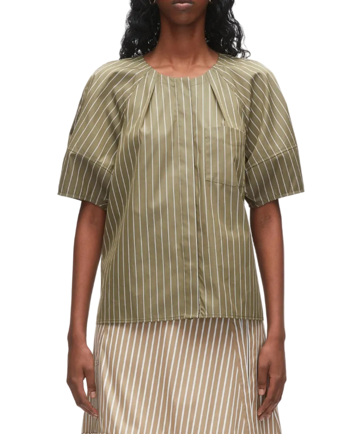 A person wearing the 3.1 Phillip Lim Stripe Lantern Sleeve Shirt paired with a beige and white striped skirt.