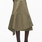 A person models the 3.1 Phillip Lim Stripe Wrap Asymmetrical Hem Skirt with a handkerchief hem and large side pocket, paired with black heeled sandals, set against a white background.