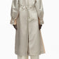 A person wearing the 3.1 Phillip Lim Blouson Trench Coat in light beige cotton-viscose twill with drawstrings at the waist and wrists, paired with matching wide-leg pants, is shown from the back against a white background.