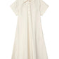 The Trapeze Midi Poplin Shirt Dress by 3.1 Phillip Lim is a cream short-sleeve, collared summer dress with chest buttons and an A-line silhouette, crafted in cotton poplin.
