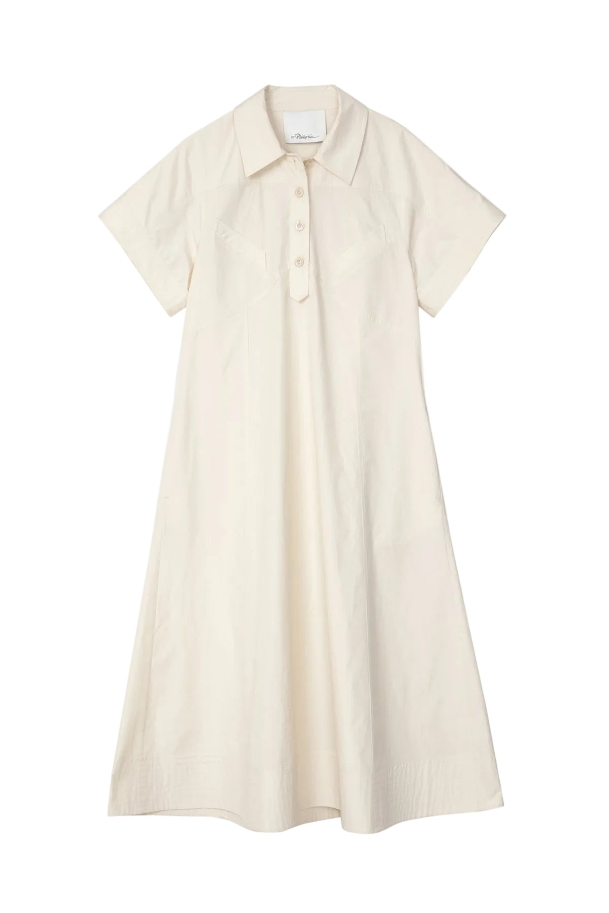The Trapeze Midi Poplin Shirt Dress by 3.1 Phillip Lim is a cream short-sleeve, collared summer dress with chest buttons and an A-line silhouette, crafted in cotton poplin.