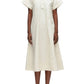 A person wearing the 3.1 Phillip Lim Trapeze Midi Poplin Shirt Dress in light beige with black flats stands against a plain background.