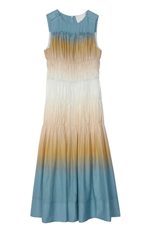 The Ombre Voile Gathered Maxi Dress by 3.1 Phillip Lim is an ankle-length, sleeveless cotton voile dress with a cinched waist and a blue, beige, and white gradient—ideal for warm weather.