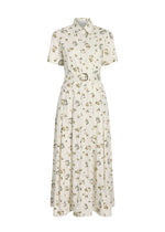 The Leighton Dress by Adam Lippes is a white, short-sleeve, button-down dress in Italian cotton poplin with a belted waist and floral print.