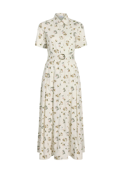 The Leighton Dress by Adam Lippes is a white, short-sleeve, button-down dress in Italian cotton poplin with a belted waist and floral print.