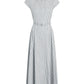 The Palmer Stripe Shirting Dress by Adam Lippes is a sleeveless, collared, button-down midi dress crafted from Italian cotton shirting with vertical grey and white stripes, finished with a matching fabric belt at the waist for a long, fluid silhouette.