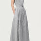 A woman wearing the Adam Lippes Palmer Stripe Shirting Dress—an ankle-length, sleeveless, button-down dress crafted from fine Italian cotton shirting and finished with a belted waist—paired with pointed-toe flats for an elegant, elongated silhouette.
