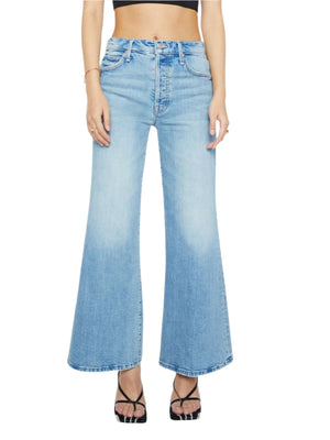 Model wears Mother PETITES The Lil Tomcat Roller Skimp high-waisted, light-wash, wide-leg jeans with black strappy high-heeled sandals, shown waist-down against a white background—ideal for the trendy petite denim look.