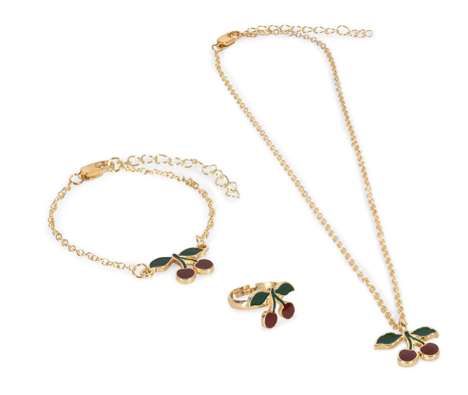 Konges Slojd Jewelery Set includes a necklace, bracelet, and ring—each with cherry charms and playful red and green enamel accents.