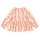 The Konges Slojd Baby Girls' and Girls' Coco Blouse features light pink muslin, a floral print, long sleeves with ruffled cuffs, front buttons, and a flared waist—combining comfort and style.