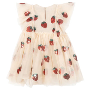The Girls' Yvonne Frill Dress by Konges Slojd is a cream short-sleeved tulle dress with voluminous ruffled shoulders, a flared skirt, and red sequin strawberry appliqués.