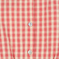 Close-up of the Konges Slojd Girls' Kim Frill Dress in red and white gingham seersucker, featuring four white buttons on the front and a gathered ruffle at the hem.