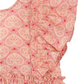 Close-up of the Girls' Ava Bow Dress by Konges Slojd, featuring soft cotton fabric, ruffled frill sleeves, and a heart-shaped pattern in light and dark pink tones with red heart accents.