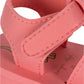 Close-up of the Konges Slojd Kids' Sable Sandal in pink, featuring velcro fastening, visible stitching, and part of the insole with printed design and text.