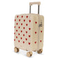 Off-white Kids’ Travel Suitcase by Konges Slojd patterned with small red hearts, featuring a retractable handle and a side TSA lock.