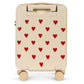 Cream-colored Konges Slojd Kids’ Travel Suitcase featuring a repeating pattern of small red hearts and a retractable handle.