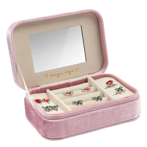 The Konges Slojd All I Wish For Jewelry Set features a pink velvet box with a mirror in the lid, ideal for kids' jewelry and dress-up, and holds colorful rings neatly arranged in slots.