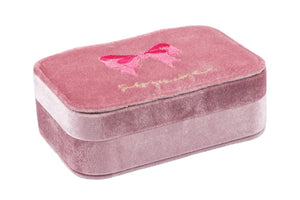 The Konges Slojd All I Wish For Jewellry Set comes in a rectangular pink velvet box with an embroidered bow on the lid—ideal for storing kids' jewelry and dress-up accessories.