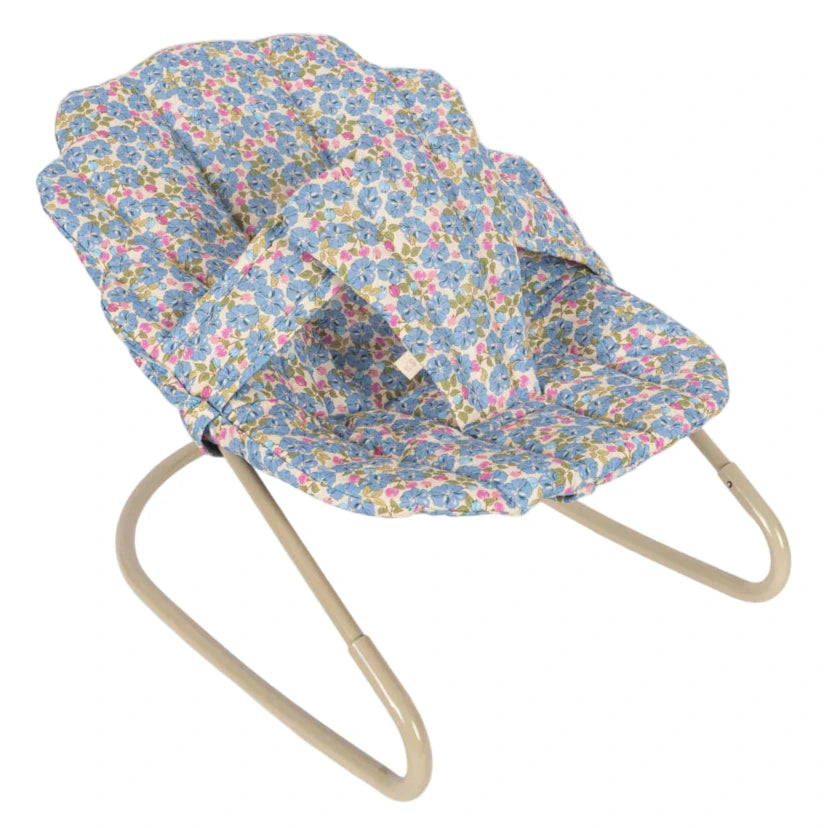 The Konges Slojd Doll Bouncer features a beige metal frame and a blue, pink, and yellow floral cotton seat with a washable cushion.