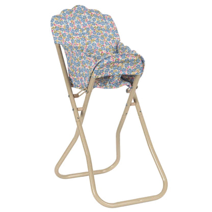 The Konges Slojd Doll High Chair is a foldable beige metal chair with a detachable seat and backrest in blue floral fabric—perfect for dolls.
