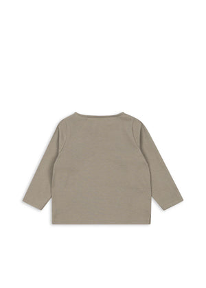 The Konges Slojd Baby Boys' and Boys' Drey Tee is a soft organic cotton, long-sleeved taupe shirt shown laid flat with the back up—perfect as an everyday kids’ basic.